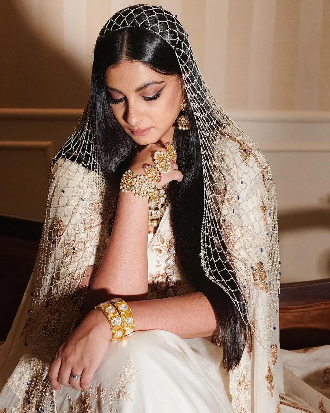 Rhea Kapoor wearing her hair down at her wedding