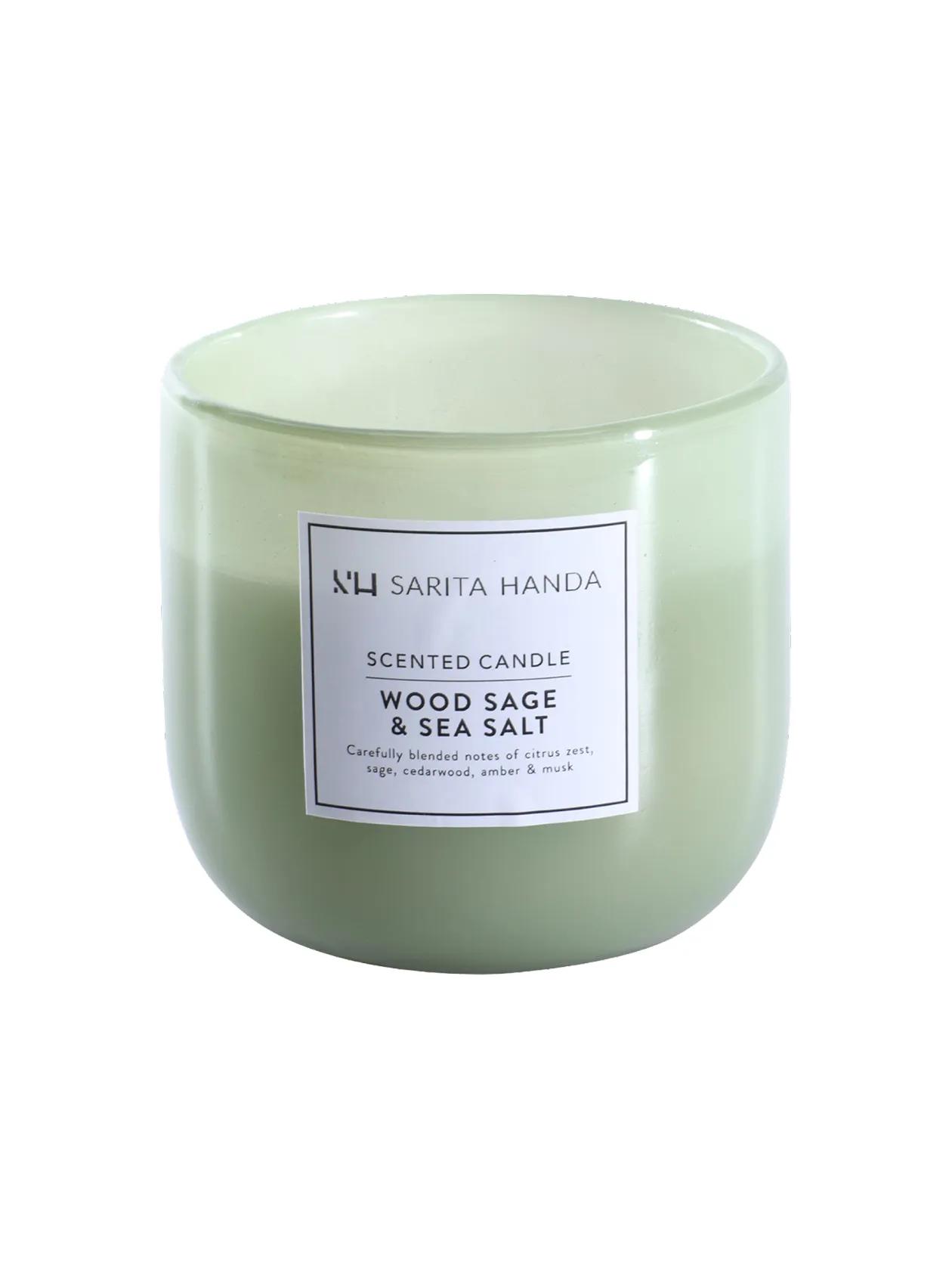 Wood sage & sea salt-scented jar candle, Sarita Handa. 