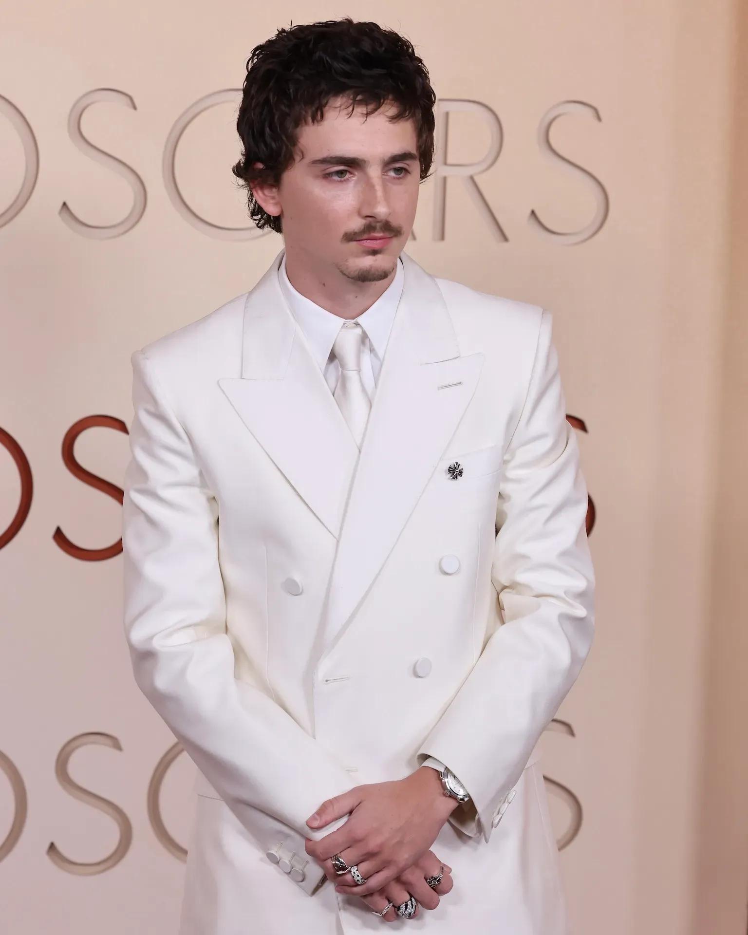 Timothée Chalamet wearing a tiny brooch at the Oscars 2026 red carpet
