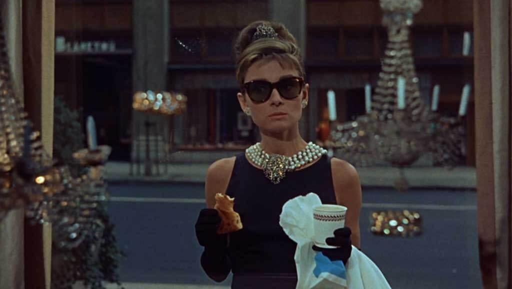 Holly (Audrey Hepburn) wearing the famous Tiffany & Co. pearl necklace in the opening scene of Breakfast at Tiffany's