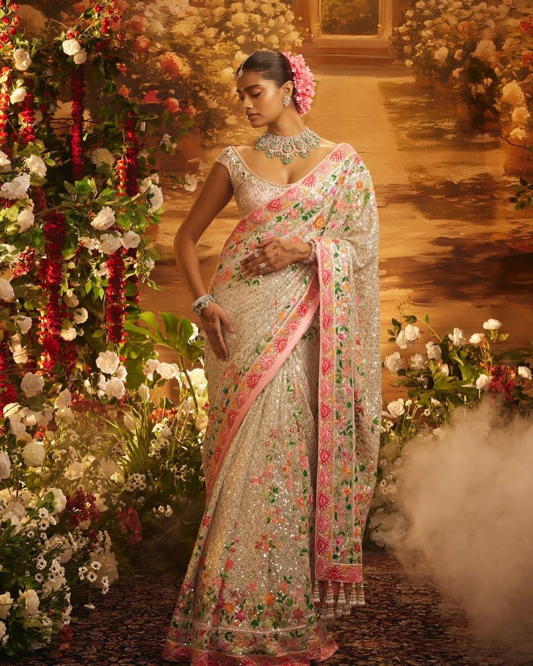 The Romance of Thread work and ivory sequin with Pearls representing a timeless Saree and Jewells