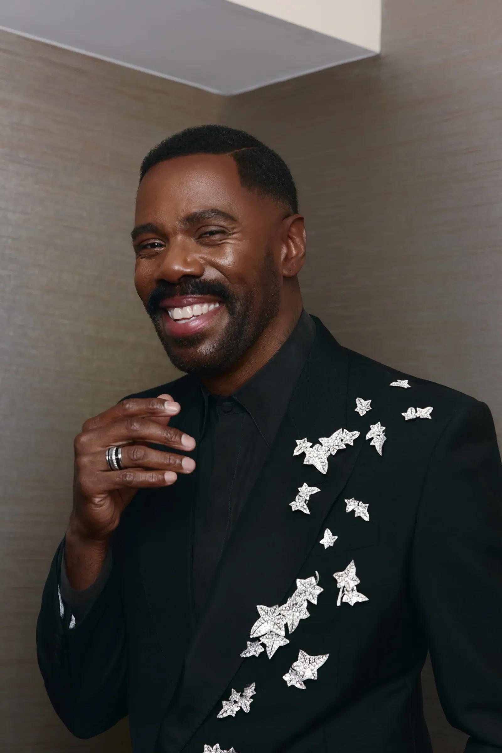 Colman Domingo wearing a cluster of brooches at the Golden Globe Awards 2026