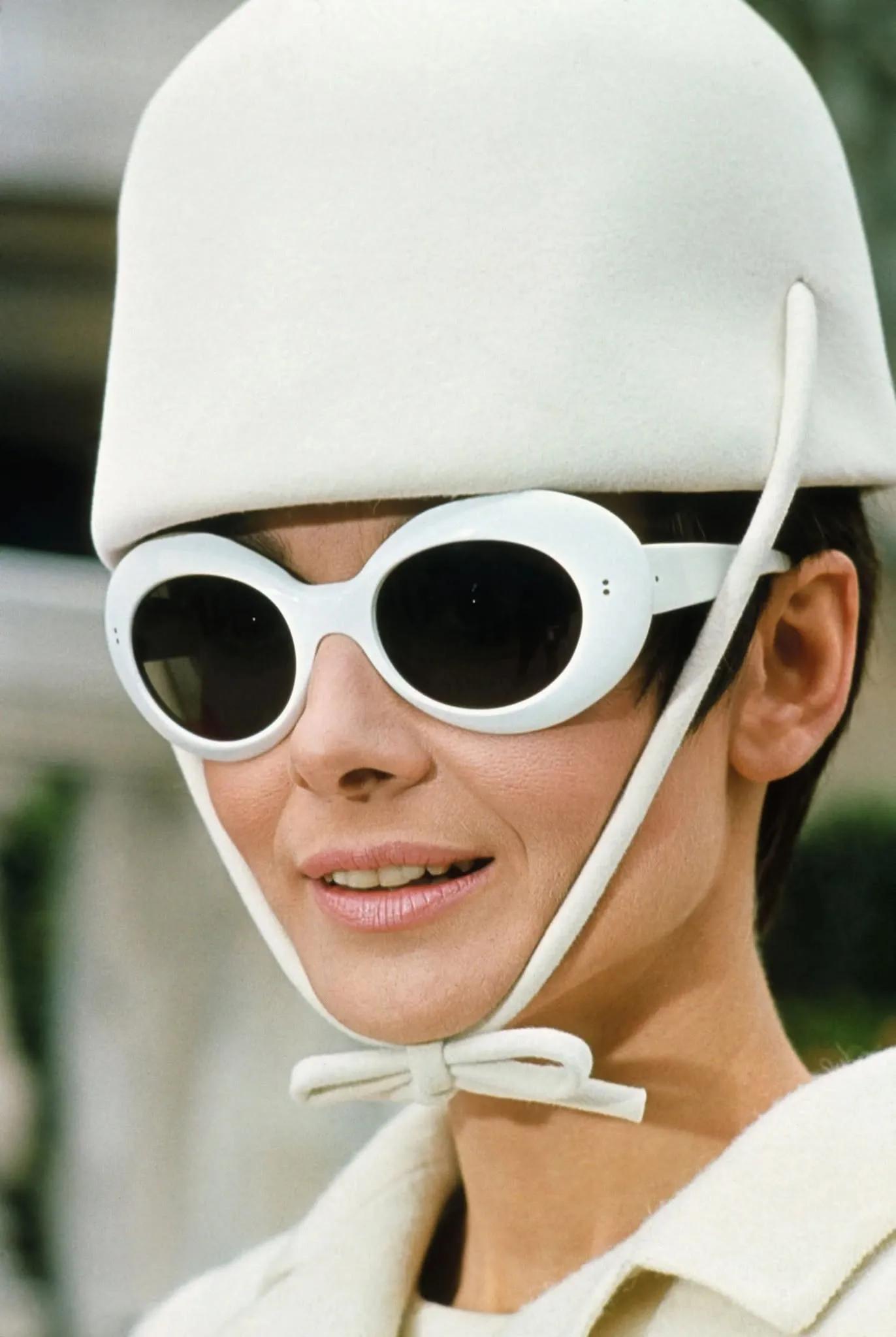 Audrey Hepburn wearing bug-eye sunglasses in the movie ‘How to Steal A Million’.