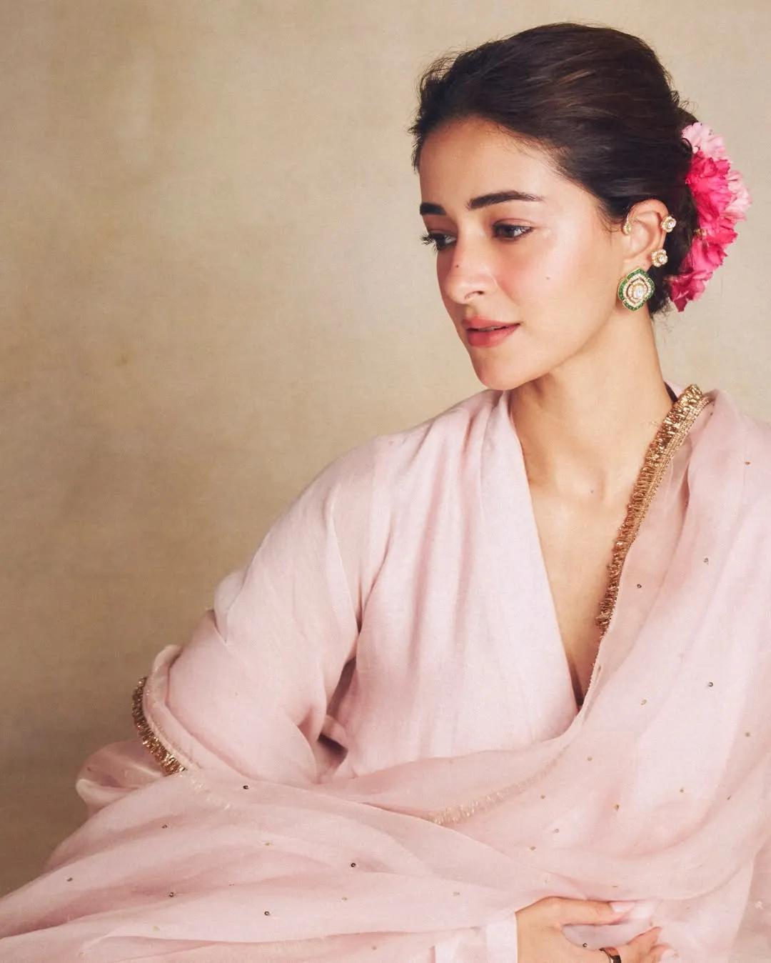 Ananya Panday wearing carnations in different shades of pink around her bun