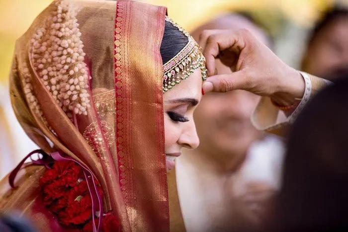 Deepika Padukone wearing her hair in an updo at her wedding