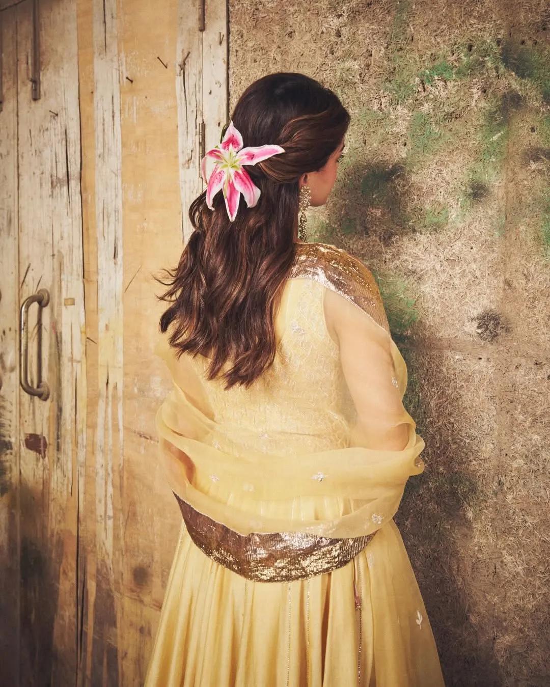 Ananya Panday wearing a lily in her hair