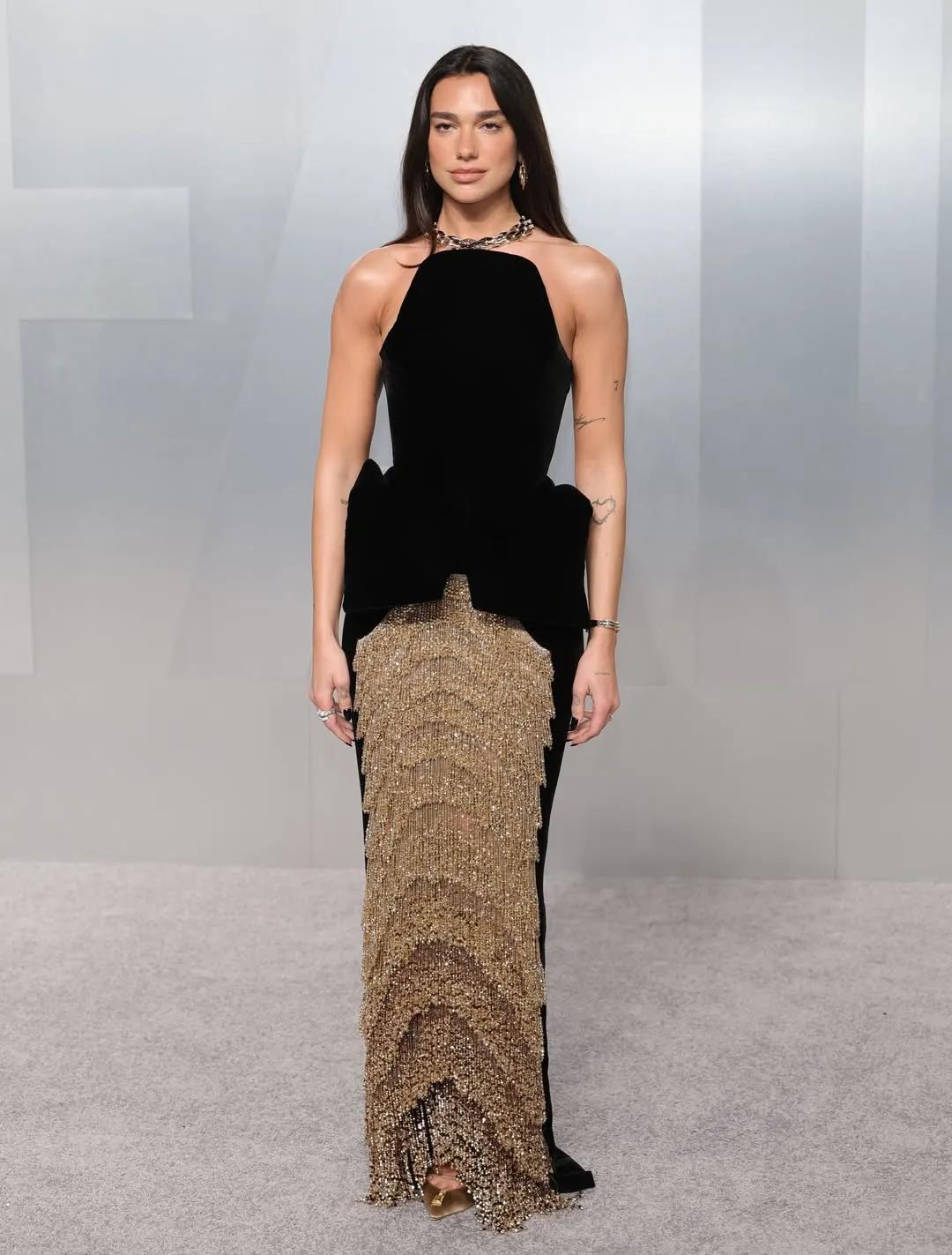 Dua Lipa in Schiaparelli keeps close to fiancé Callum Turner at the 2026 Vanity Fair Oscar Party