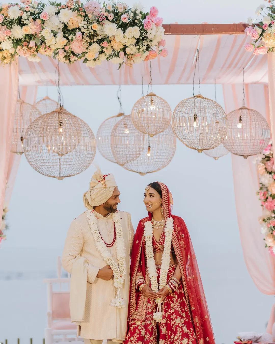 Golden mesh lights, pastel drapes, and serene florals, the mandap was a soft dream under the pin