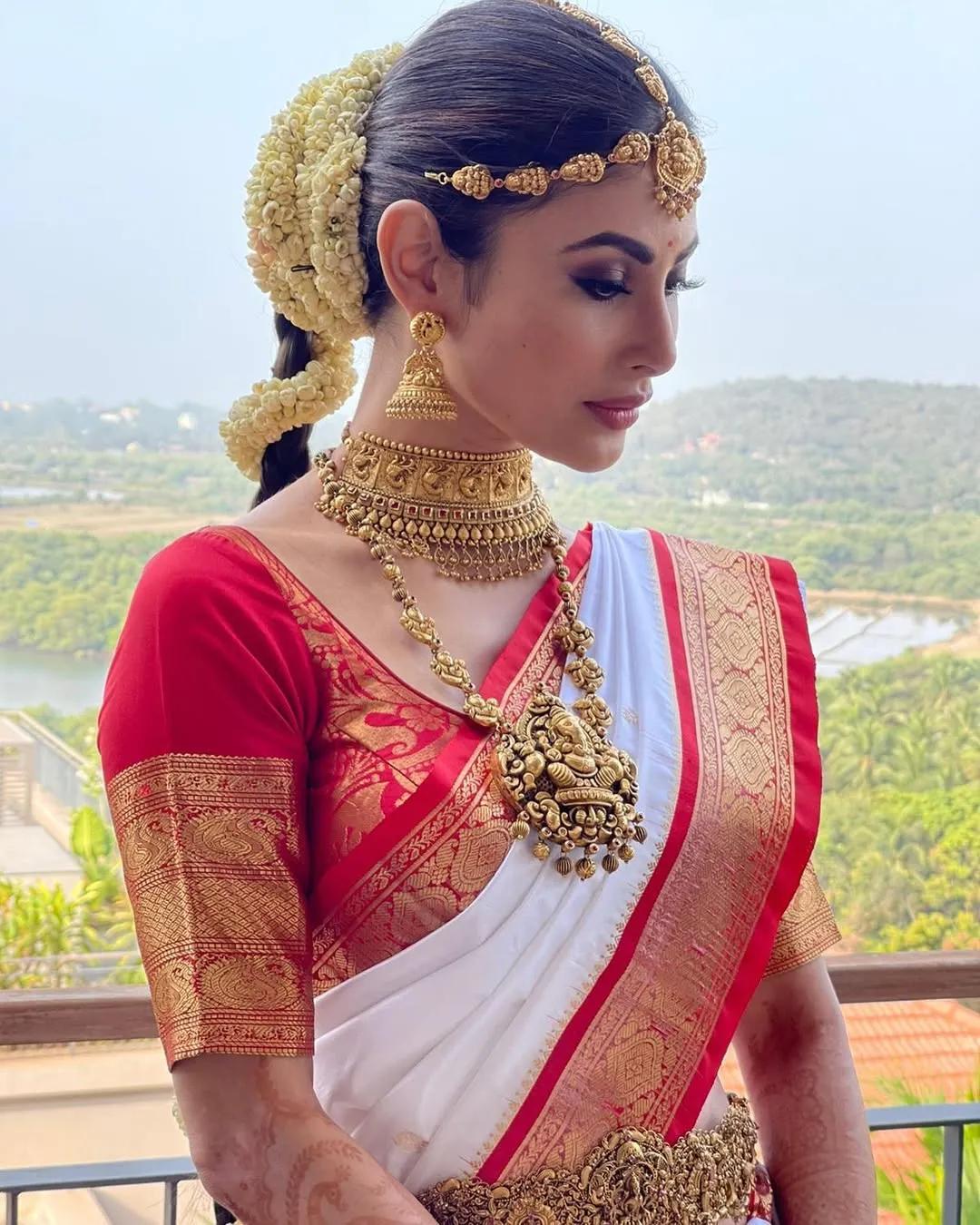 Mouni Roy wearing her hair in a braid at her wedding