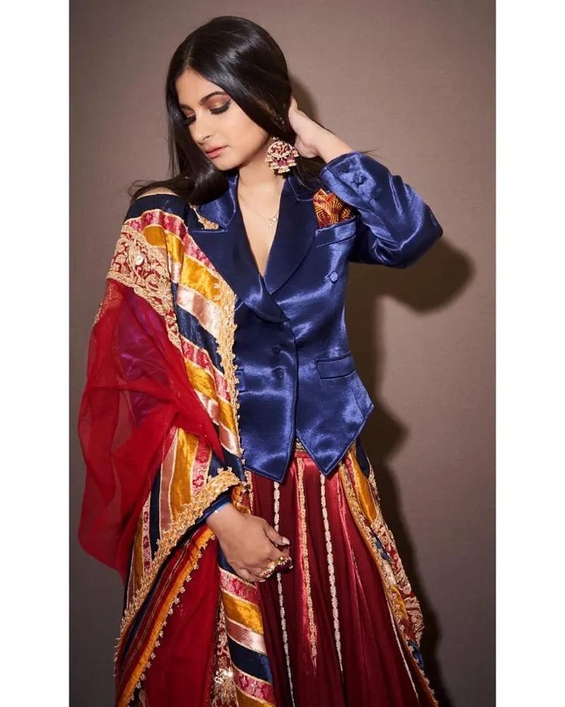 Rhea Kapoor in a men's jacket paired with a lehenga—a more subtle take on androgynous dressing